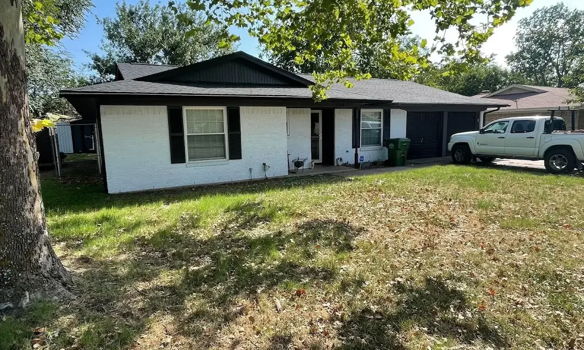 Professional roofing crew working on a residential roof in West Richland